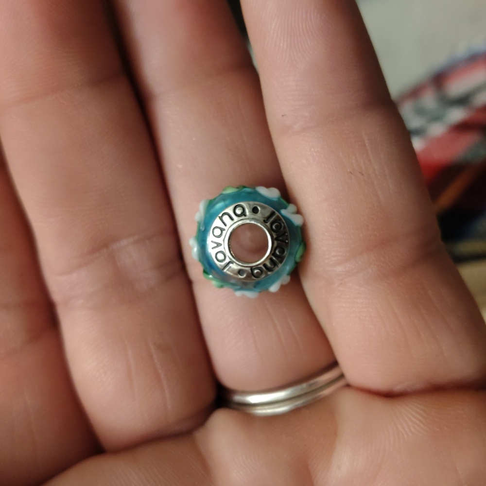 Glass bead with lily accents